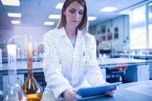 Scientist working with a tablet in laboratory