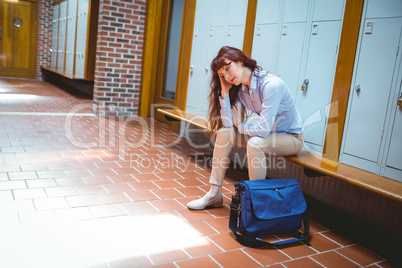 Mature student feeling stressed in hallway