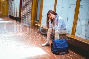 Mature student feeling stressed in hallway