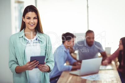 Young creative worker using tablet