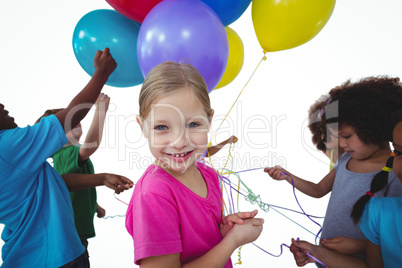 Group of kids together with balloons