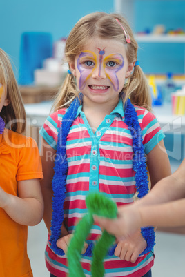 Happy girl with her face painted