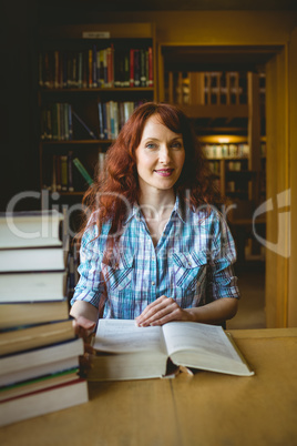 Mature student studying in library