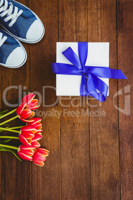 View of sneakers and blue gift