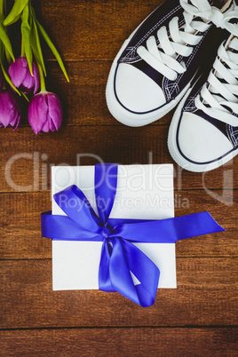 View of sneakers and blue gift