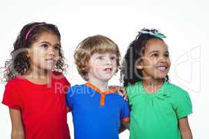 Three small kids standing in a line