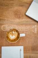 Above view of a laptop and a coffee