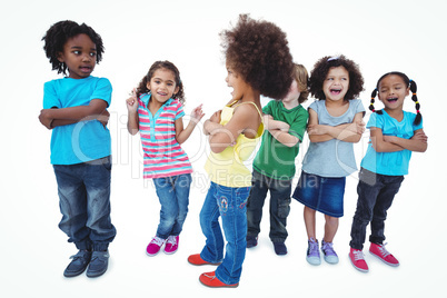 A row of children standing together with crossed arms