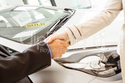 Salesman shaking a customer hand