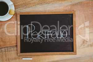 Portfolio against a big blackboard