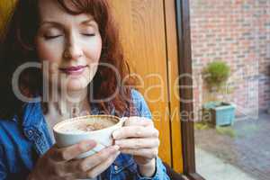 Mature student having coffee in cafe