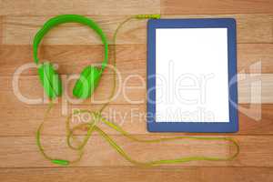 View of a green headphone with a blue tablet
