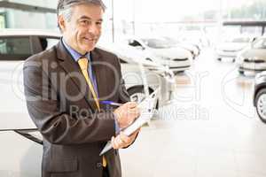 Portrait of a salesman with clipboard