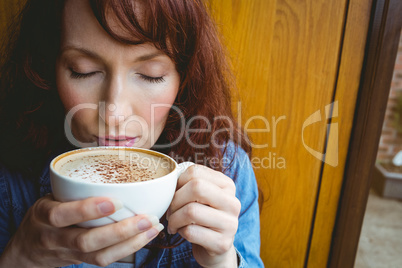 Mature student having coffee in cafe