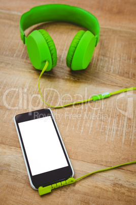 Green headphone with a back smartphone