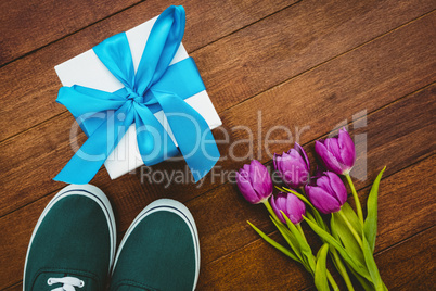 View of sneakers and blue gift