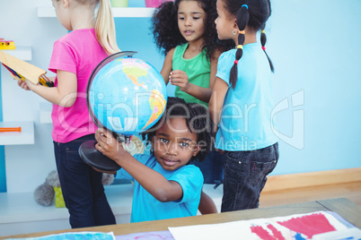 Small group of kids in playing with toys