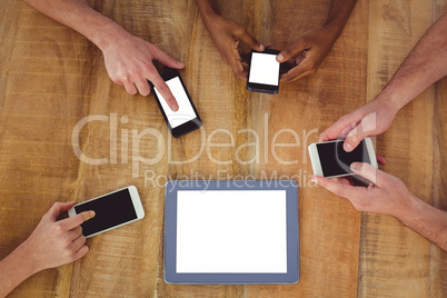 Creative team working together on a tablet and smartphones