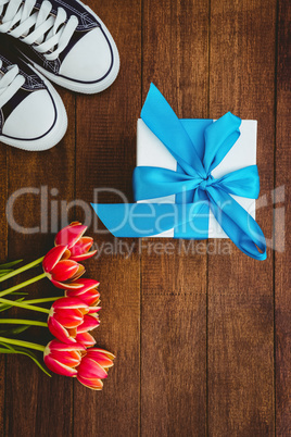 View of sneakers and blue gift