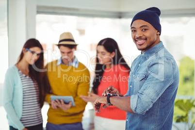 Young creative team smiling at camera