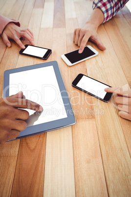 Young creative team using phones and tablet