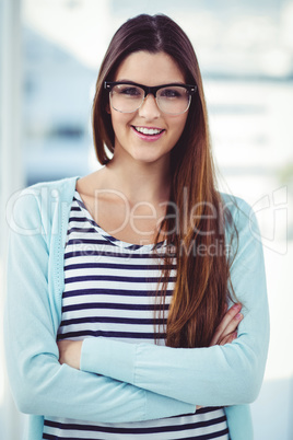 Young creative worker smiling at camera