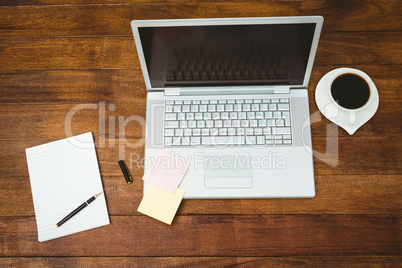 View of a grey laptop with coffee