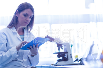 Scientist working with a tablet in laboratory