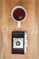 View of an old camera and a coffee