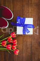 View of red flowers and blue gifts
