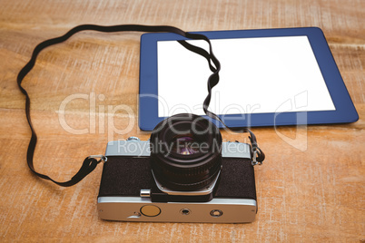 View of an old camera and a blue tablet