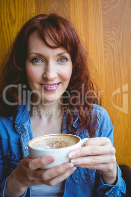 Mature student having coffee in cafe