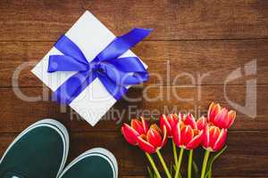 View of sneakers and blue gift