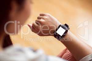 Asian woman using smart watch with copy space