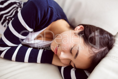 Asian woman napping on the couch