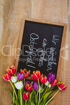 Bouquet of colored flowers against black board