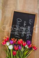 Bouquet of colored flowers against black board