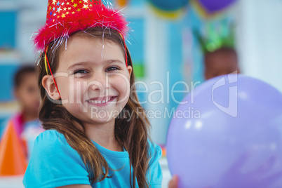 Happy kid holding a balloon