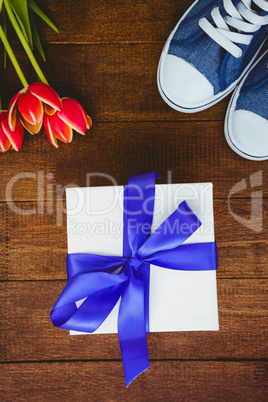 View of sneakers and blue gift