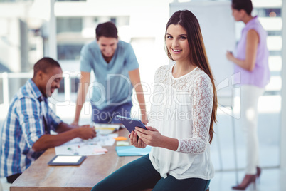 Young creative worker using tablet