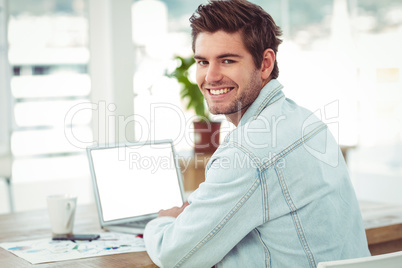 Creative businessman working on his laptop