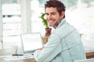 Creative businessman working on his laptop