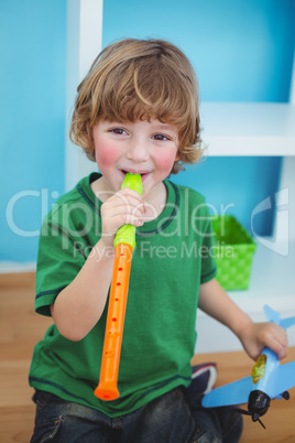 Small boy playing the flute