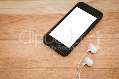 Black smartphone with white headphones