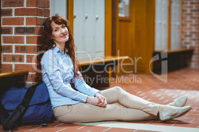 Mature student smiling at camera in hallway Mature student smiling at camera in hallway