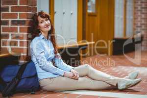 Mature student smiling at camera in hallway