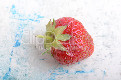 Close up of strawberry with green leaves