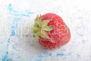 Close up of strawberry with green leaves