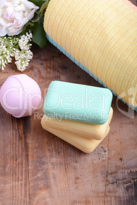 towels set, aroma therapy, soap and sea salt on wooden plate