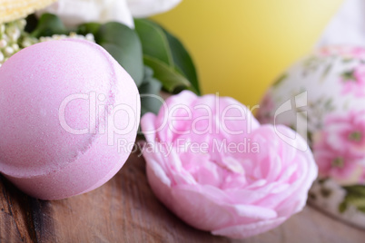 Spa theme with candles and flowers on wooden background